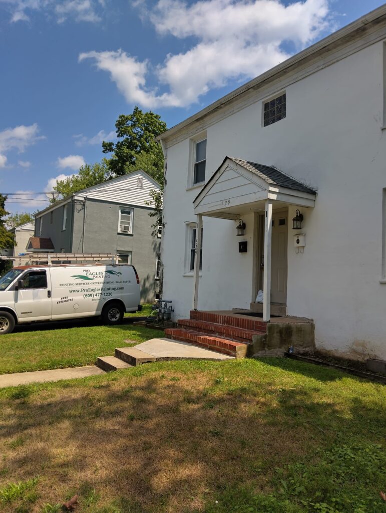 Eagles Painting - House Ready for Exterior Paint Restoration with Company Vehicle in View